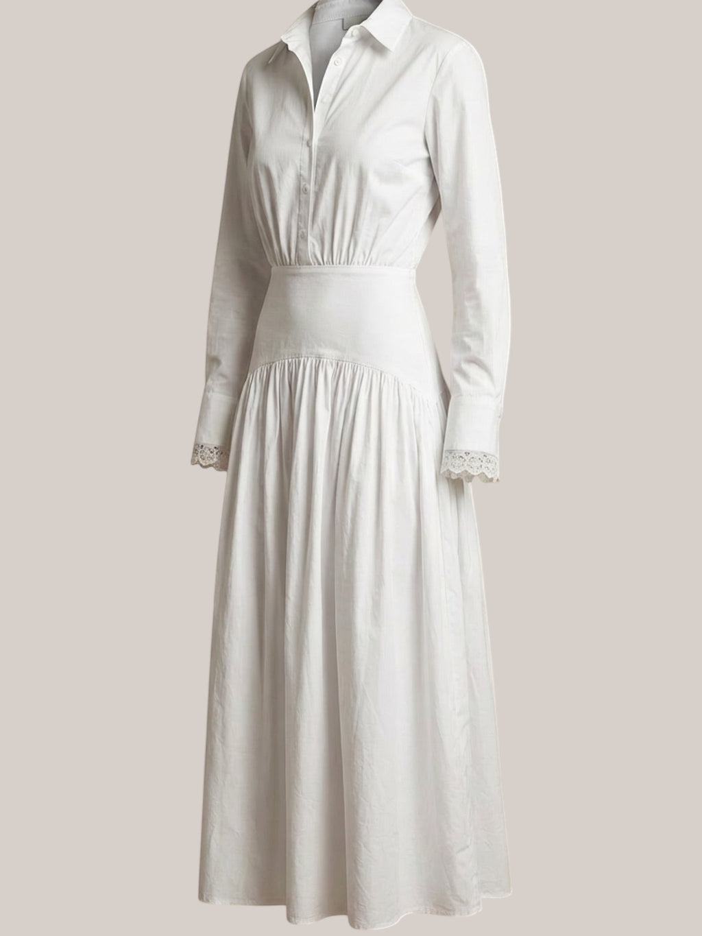 Celeni white cotton poplin maxi shirt dress with lace detail on collar and cuffs, featuring a special hip cut and button front.