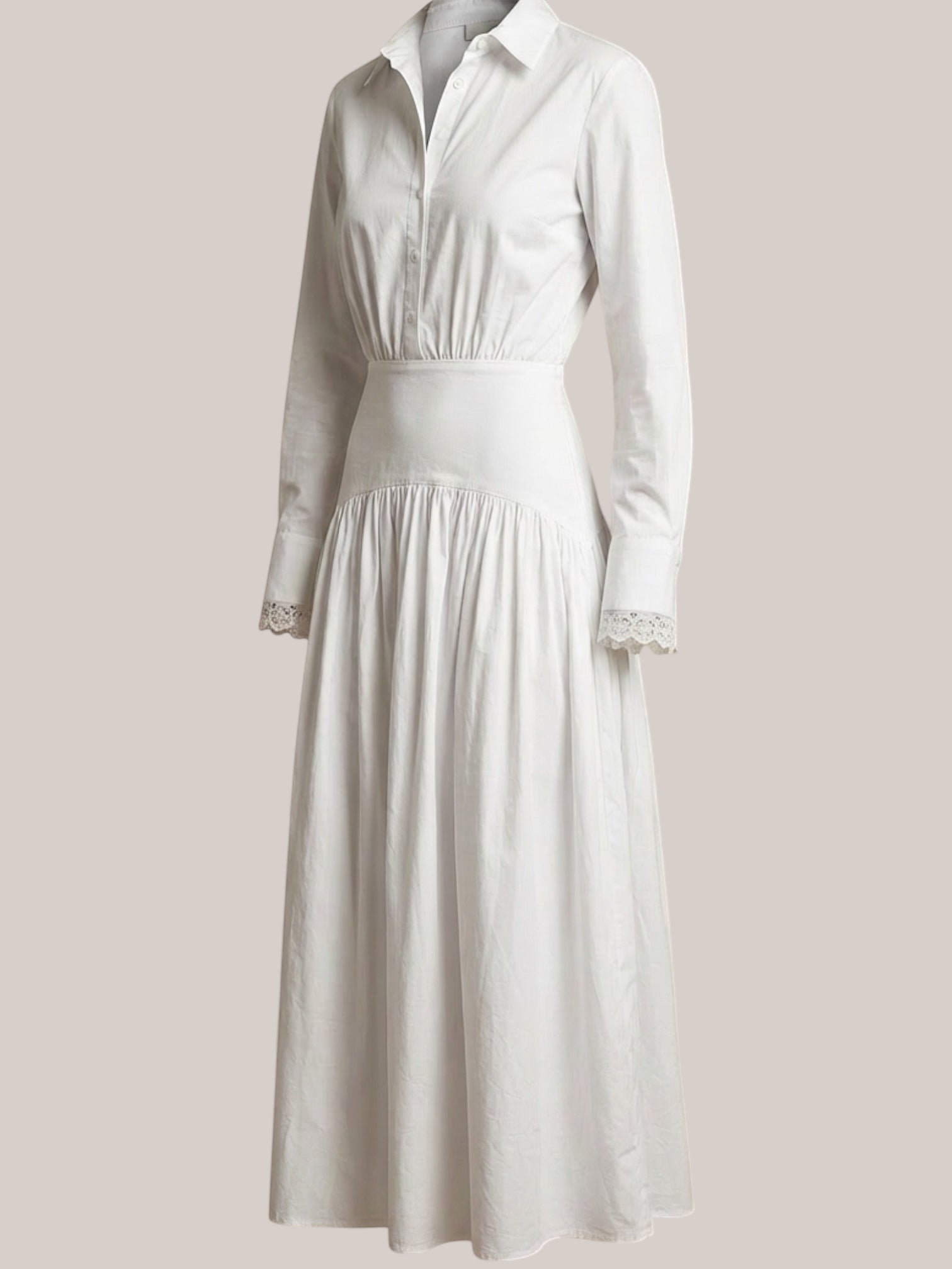 Celeni white cotton poplin maxi shirt dress with lace detail on collar and cuffs, featuring a special hip cut and button front.