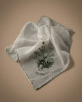 Celeni white linen square scarf with green floral embroidery and scalloped edge. 42x42cm.